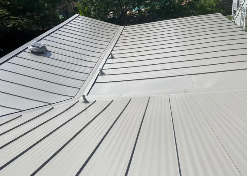 Solar attic fan installed on a metal roof for Roof Ventilation in Chino Hills